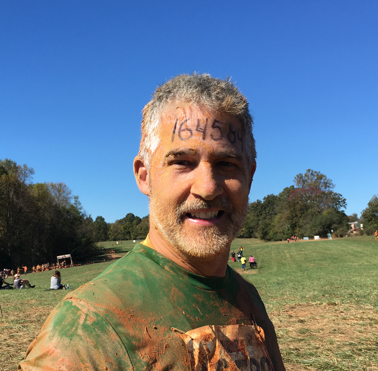 Active adult over 40 finishing a mud run